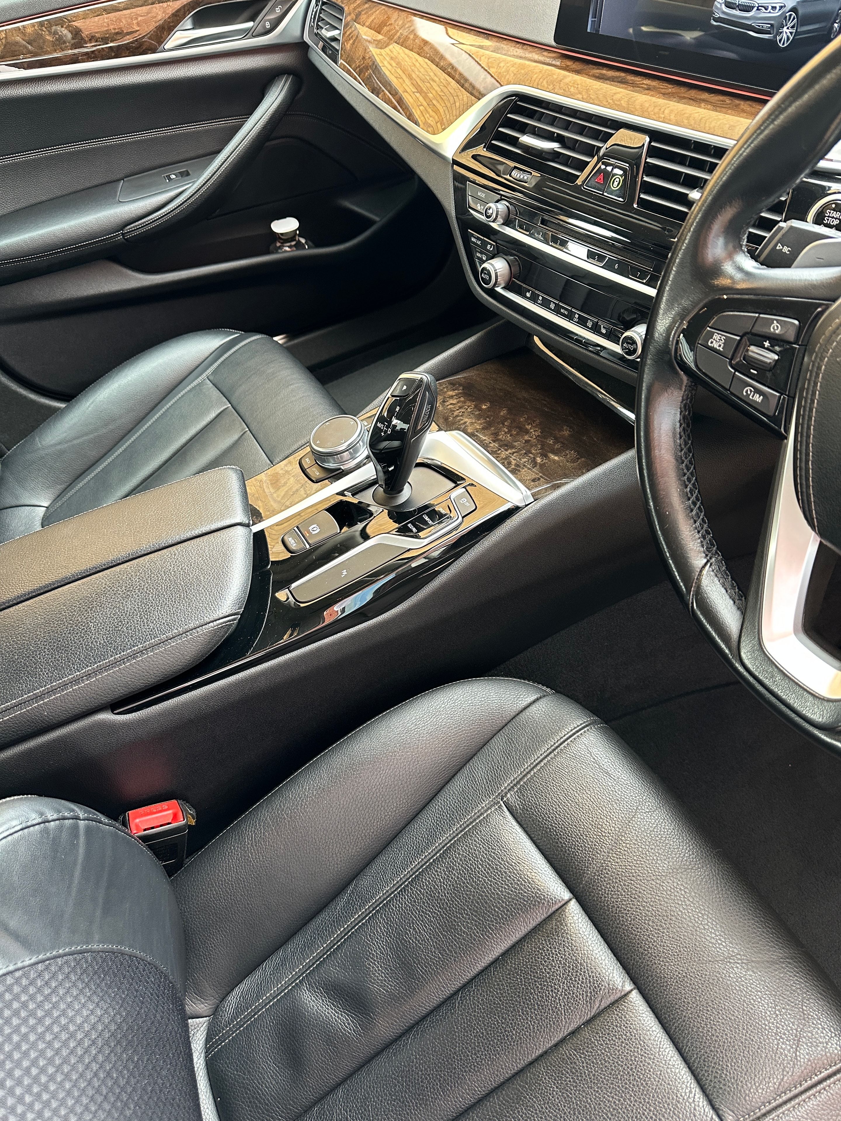Freshly detailed car interior with clean leather seats and dashboard
